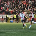 Jacob Davenport congratulates Derry City goal scorer Pat Hoban. Photograph: George Sweeney
