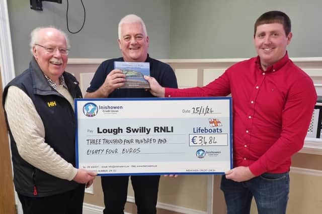 Bernard handing over a cheque to the Lough Swilly RNLI.