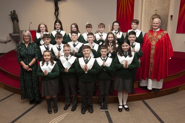 Pupils from Mrs. Fiona Gallick’s  class at Greenhaw Primary School who received the Sacrament of Confirmation from Fr. John Farren at St. Brigid’s Church, Carnhill on Monday afternoon last. (Photo: Jim McCafferty Photography)