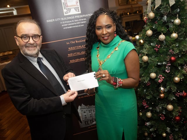 John Meehan, Inner City Trust, pictured handing over a cheque to the Mayor, Lilian Seenoi-Barr, for her chosen charity, at the Bishop's Gate Hotel, Derry on Thursday afternoon last. The event was part of the Inner City Trust's Annual Charity Giving.