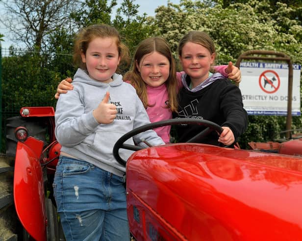 Briona, Erin and Lucy, from Muff, pictured at the Muff Vintage Show held in the Community Park on Sunday. Photo: George Sweeney.  DER2321GS – 13 