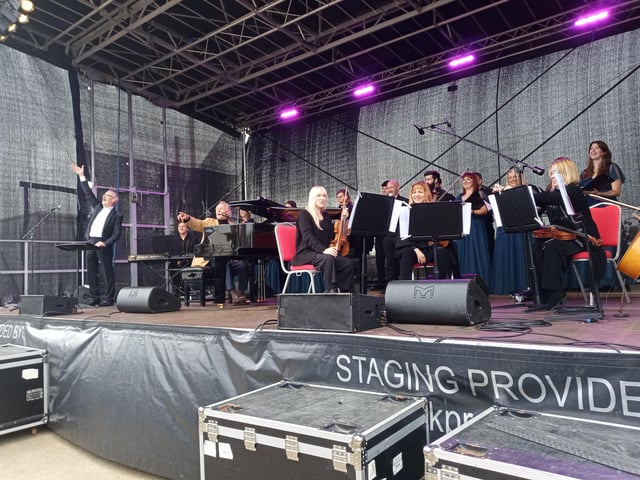 Phil with the musicians and choir.