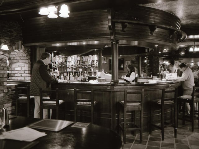 Staff and customers at Duke's Bar in the Waterside.