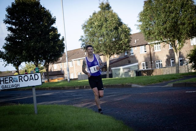 RACE WINNER!. . . . Foyle Valley's Matthew McLaughlin makes his way towards the finish line in the Galliagh Feile 5k race on Friday night last. (Photos: Jim McCafferty Photography)