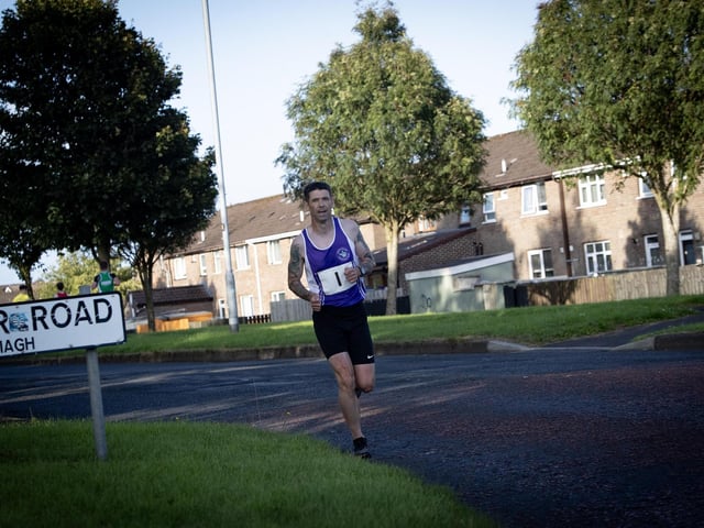 RACE WINNER!. . . .  Foyle Valley's Matthew McLaughlin makes his way towards the finish line in the Galliagh Feile 5k race on Friday night last. (Photos: Jim McCafferty Photography)