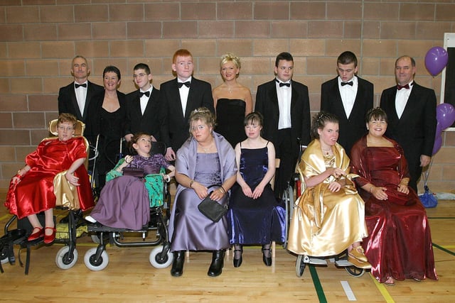Guests attending the Foyle View Special School's inagural formal held at Pitchers.  From left (seated), are Sarah O'Donnell, Charlene Ryan, Christina Cresswell, Susan Hancock, Patricia Fleming and Laura Holmes.  Back row, teachers Dan Burns and Harriett Glove, with Christopher Watson, Aiden McCormick, Alison January, classroom assistant, Cathal O'Kane, Kevin Quinn and Ross Laird, teacher in the senior department.  (0112T03).:.