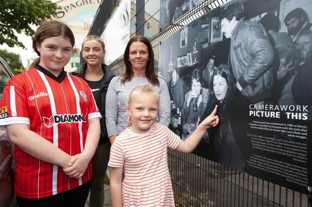 THAT'S MY GRANNY!. . . . The late Roisin Barton's daughter Aine pictured with Roisin's granddaughters Clodagh, Roisin and Seorlaith at the 'Camerawork Picture This' exhibition outside Pilot's Row Centre on Friday evening. The exhibition was the opening event of this year's Gasyard Féile 23. (Photos: Jim McCafferty Photography)