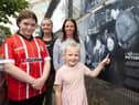 THAT'S MY GRANNY!. . . . The late Roisin Barton's daughter Aine pictured with Roisin's granddaughters Clodagh, Roisin and Seorlaith at the 'Camerawork Picture This' exhibition outside Pilot's Row Centre on Friday evening. The exhibition was the opening event of this year's Gasyard Féile 23. (Photos: Jim McCafferty Photography)
