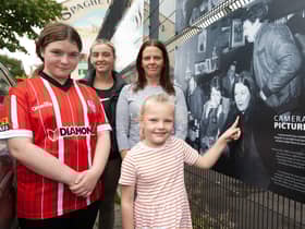 THAT'S MY GRANNY!. . . . The late Roisin Barton's daughter Aine pictured with Roisin's granddaughters Clodagh, Roisin and Seorlaith at the 'Camerawork Picture This' exhibition outside Pilot's Row Centre on Friday evening. The exhibition was the opening event of this year's Gasyard Féile 23. (Photos: Jim McCafferty Photography)