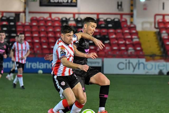 Derry City’s Adam O’Reilly and Patrick McEleney of Ballymena United battle for possession. Photograph: George Sweeney