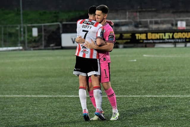 Michael Duffy and Brian Maher celebrate Derry City’s FAI Cup quarter-final win over Shelbourne. Photograph: George Sweeney
