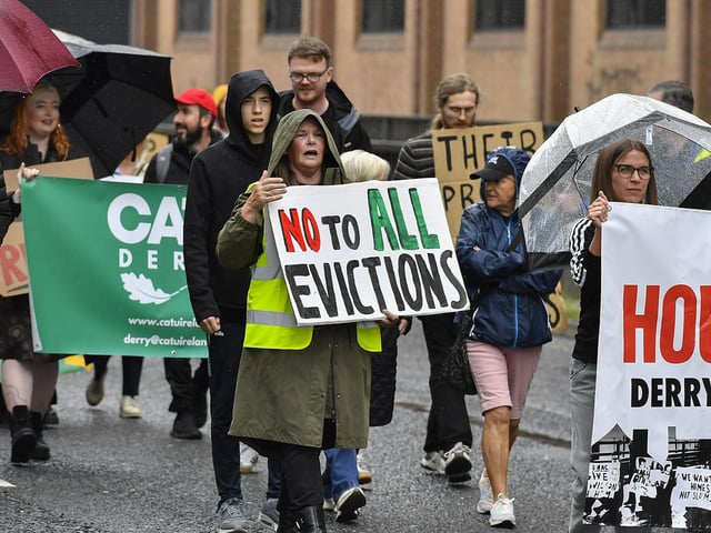 Participants carry placards during the Derry Housing Action Committee protest march over housing crisis on Saturday afternoon Photo: George Sweeney