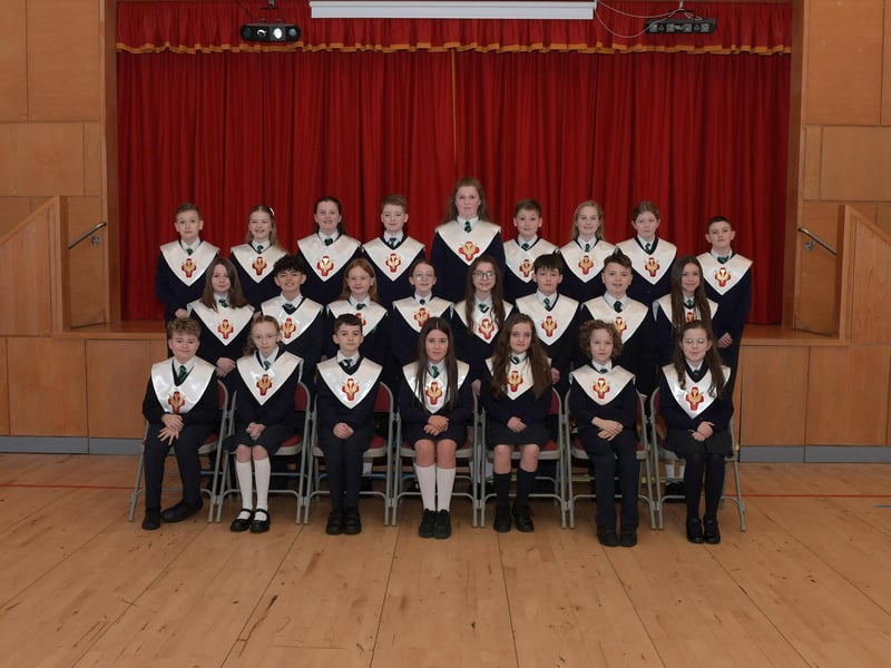 Mrs. P. Smith’s pupils from St Patrick’s Primary School who recently made their Confirmation at St Patrick’s Church in Pennyburn. Included in the photograph is Mr. J. Bradley (teacher).  Photo: George Sweeney