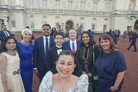 Jonah Atos and colleagues at a reception with the King. Picture: Western Trust