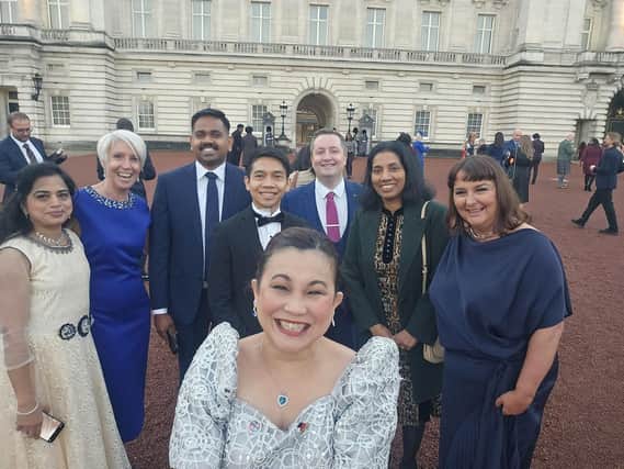 Jonah Atos and colleagues at a reception with the King. Picture: Western Trust