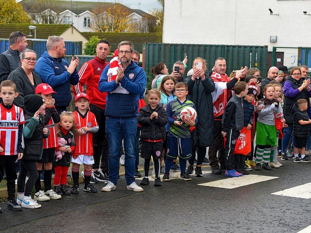 Fans gather at Brandywell Stadium on Saturday morning to give wish Derry City players and coaches good luck as they depart for Dublin ahead of tomorrow’s FAI Cup Final against Shelbourne. George Sweeney.  DER2244GS – 40