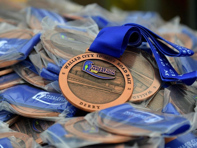 Runners who completed the Bentley Group Derry 10 Miler Road Race received a commemorative medal. Photo: George Sweeney. DER2310GS – 109