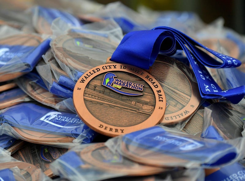 Runners who completed the Bentley Group Derry 10 Miler Road Race received a commemorative medal. Photo: George Sweeney. DER2310GS – 109