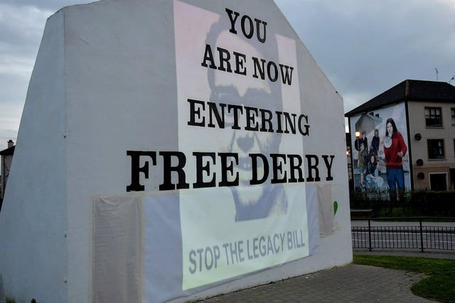 A photograph of William McKinney, Derry Journal printer, murdered on Bloody Sunday on 30 January 1972 was among the images of 269 victims of state violence projected onto Free Derry Wall during Monday evening’s protest against the British government’s controversial Legacy Bill. The protest was organised by the Bloody Sunday Trust and the Pat Finucane Centre. Photo: George Sweeney. DER2313GS – 07