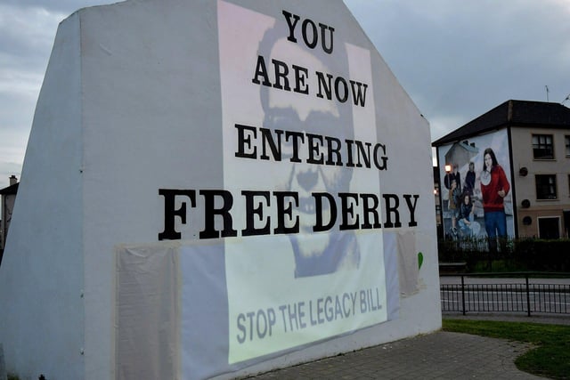 A photograph of William McKinney, Derry Journal printer, murdered on Bloody Sunday on 30 January 1972 was among the images of 269 victims of state violence projected onto Free Derry Wall during Monday evening’s protest against the British government’s controversial Legacy Bill. The protest was organised by the Bloody Sunday Trust and the Pat Finucane Centre.  Photo: George Sweeney.  DER2313GS – 07