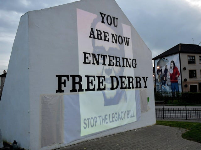 A photograph of William McKinney, Derry Journal printer, murdered on Bloody Sunday on 30 January 1972 was among the images of 269 victims of state violence projected onto Free Derry Wall during Monday evening’s protest against the British government’s controversial Legacy Bill. The protest was organised by the Bloody Sunday Trust and the Pat Finucane Centre. Photo: George Sweeney. DER2313GS – 07