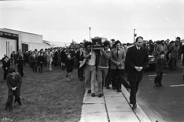 Jim Loughrey's coffin is carried from Star of the Sea chapel in Faughanvale.