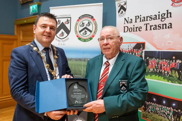 Doire Trasna GAC who are celebrating their 25th Anniversary received a commemorative crystal gift from the Mayor Councillor Ruairi McHugh in the Guildhall to mark their outstanding contribution to sport, community life and promotion of Gaelic games. During the evening the club’s traditional band and Irish dancers entertained guest with performances. The award was received by club President, Eddie Nash. Picture Martin McKeown. 22.01.26