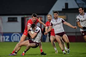 Derry’s Anton Tohill contests possession with Galway’s Matthew Tierney. Photo: George Sweeney