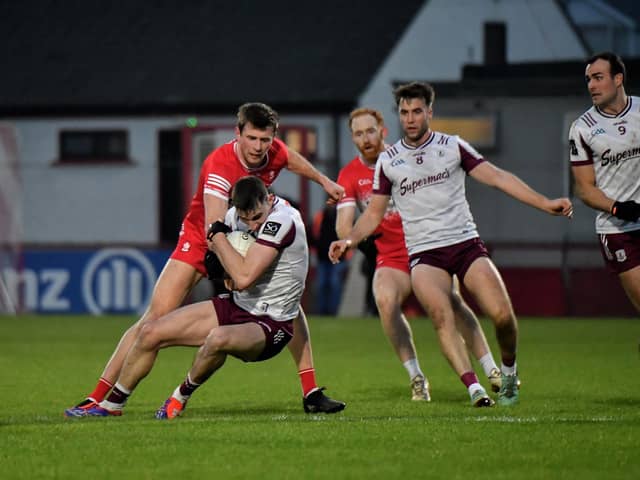 Derry’s Anton Tohill contests possession with Galway’s Matthew Tierney. Photo: George Sweeney