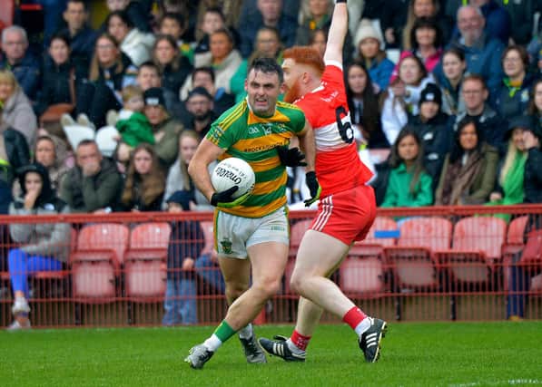 Glenullin ‘s Eoin Bradley holds off Drumsurn's Dara Rafferty during the IFC final at Celtic Park on Sunday afternoon last.   Photo: George Sweeney.  DER2243GS – 041