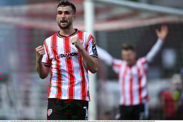 Michael Duffy celebrates his side's third goal, scored by team-mate Danny Mullen.