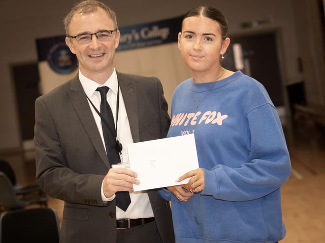 St. Mary's Principal Mr. Brendan McGinn with the first girl through the door on Thursday morning to pick up her A Level results - Emily McDaid. (Photos: Jim McCafferty Photography)