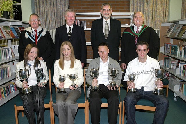 Students who collected awards at Clondermot High School's annual Prize-Giving. Seated (from left), Catherine Pollock, PTA cup for Outstanding Service to the School and the cup for Advanced Science in Year 14, Claire Smith, cup for Academic Excellence, and the cup for Religious Education, Gary Orr, trophy for Effort and Achievement and for General Excellence in Year 12, and Nigel Campbell, the PTA cup for Outstanding service to the School and the cup for Advanced IT in Year 14.  Standing (from left) are Robert Logue, vice-principal, Bertie Faulkner, chairman of the Schools Board of Governors, Rev. Bert Tosh, guest speaker and John Magowan, Headmaster. (2810T05).:Derry and Donegal secondary school pupils in October 2003