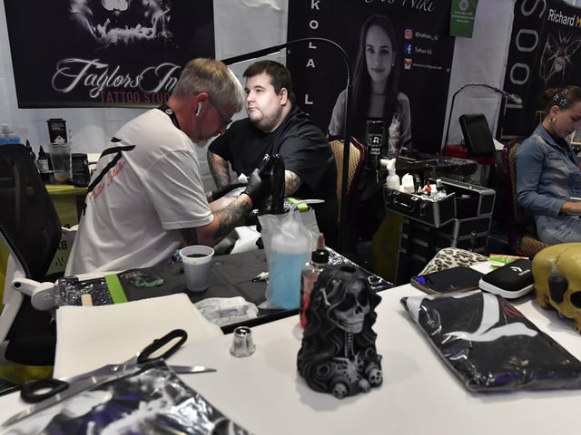 Tattoo artists at the annual Maiden City Ink International Tattoo Convention held in the Everglades Hotel. Photo: George Sweeney