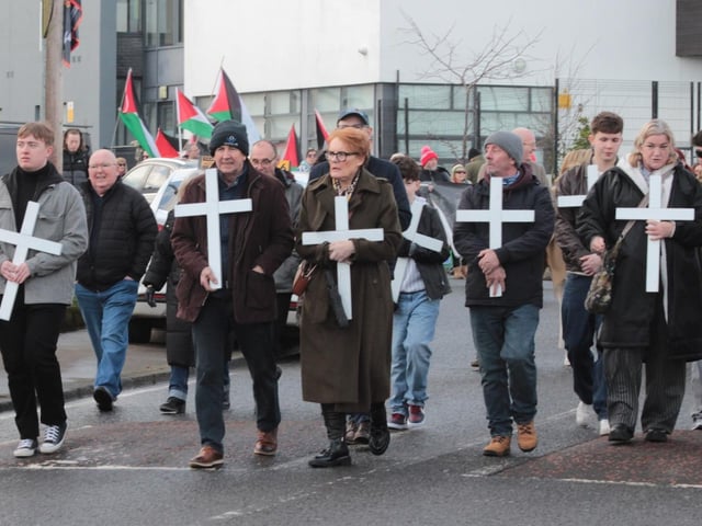 Bloody sunday families carrying crosses in memory of their loved ones at the start of the march as it left Creggan Shops.  (Photo - Deirdre Heaney, nwpresspics)