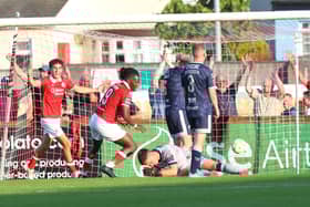 Brian Maher holds his head in his hands after his mistake led to Wilson Waweru's goal in the first half.