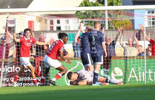 Brian Maher holds his head in his hands after his mistake led to Wilson Waweru's goal in the first half.