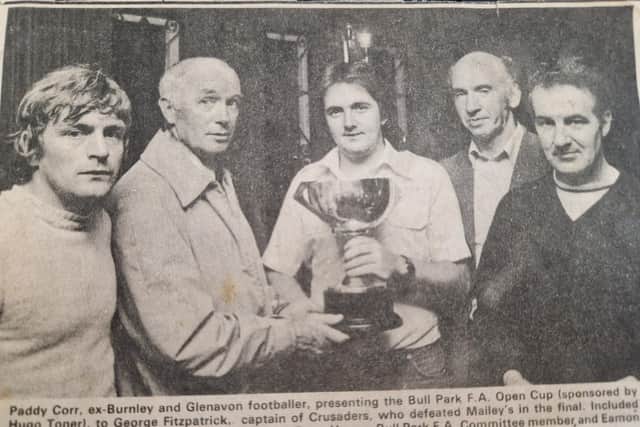 Peter Corr, ex-Burnley and Glenavon footballer, presenting the Bull Park F.A. Open Cup (sponsored by Hugo Toner), to George Fitzpatrick, captain of Crusaders, who defeated Mailey's in the final. Included from left are, Robert Kelly, captain of Mailey's, Peter Hagan, Bull Park F.A. committee member and Eamon Doherty, competition organiser.