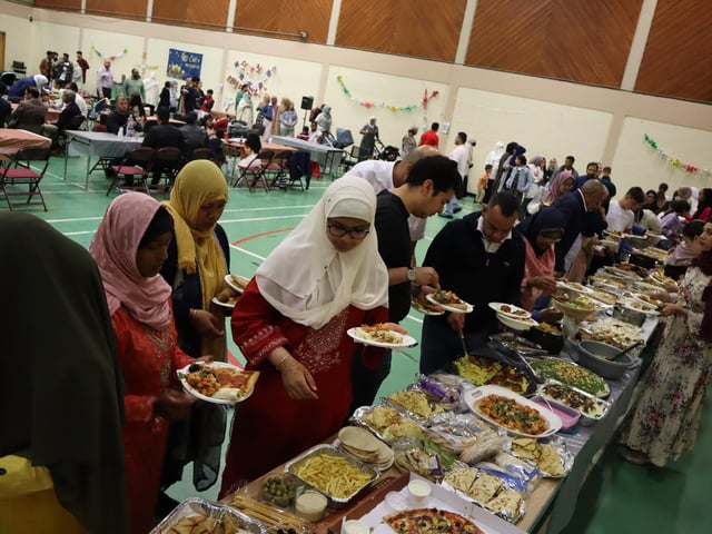 Families brought dishes to share during the Eid al-Adha celebrations.