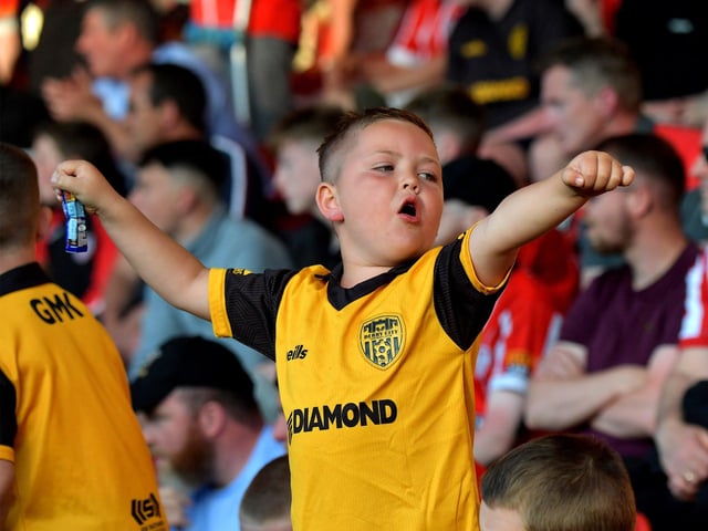 Young fan Braelin cheering on the Candystripes against Shelbourne in the Ryan McBride Brandywell Stadium. Photo: George Sweeney. DER2321GS - 79