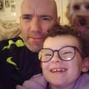 Neil Doherty with his daughter Clodagh and the family's pet dog Clifford.