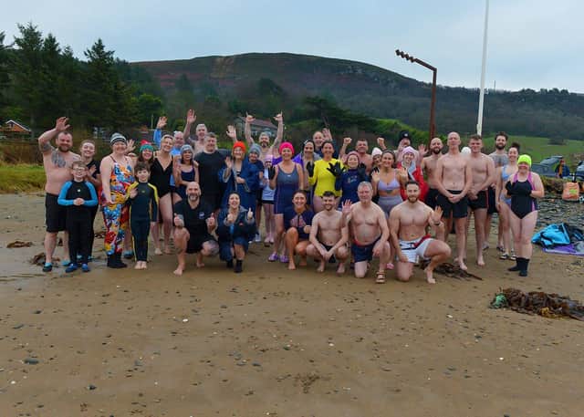 Swimmers who participated in the annual ARC Fitness New Year’s Day Charity Swim at Lisfannon beach. Photo: George Sweeney. DER2301GS – 01