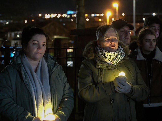 People carry candles at the procession and vigil for the children of Palestine at the Bloody Sunday Monument on Rossville Street. Photo: George Sweeney