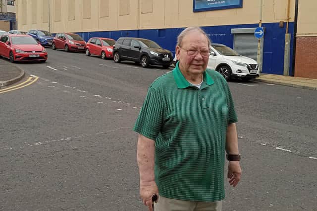 The late Raymond Rogan, pictured here in 2021 outside the Stardust, which he managed for many years.