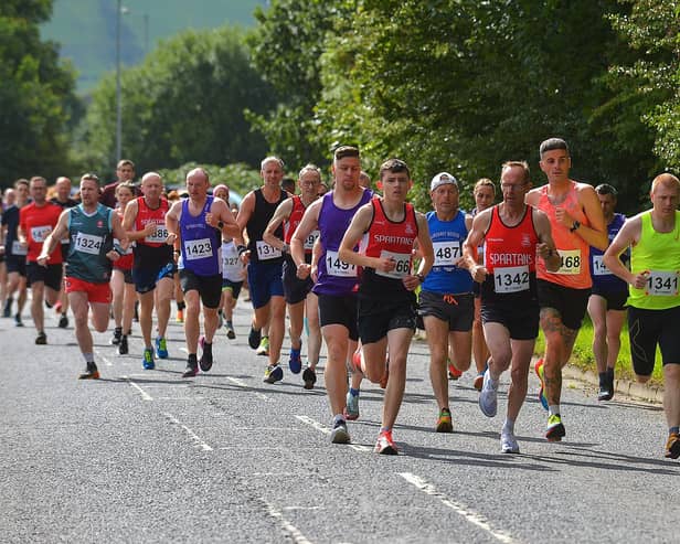 City of Derry Spartans Aidan Healey (1366) and Jim Doyle (1342) were early leaders in the Eglinton Runners charity 5K race and walk, in aid of the Rainbow Centre and the Men's Shed Eglinton, at Campsie on Sunday. Photo: George Sweeney. DER2331GS - 01