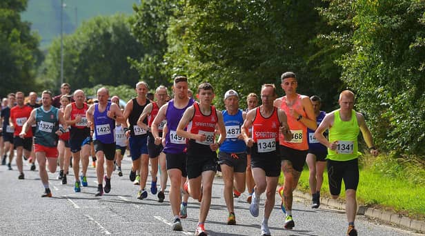 City of Derry Spartans Aidan Healey (1366) and Jim Doyle (1342) were early leaders in the Eglinton Runners charity 5K race and walk, in aid of the Rainbow Centre and the Men's Shed Eglinton, at Campsie on Sunday. Photo: George Sweeney. DER2331GS - 01