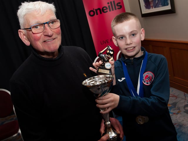 John ‘Jobby’ Crossan presenting the u-12 Player of the Year trophy to Sam Turner, Clooney FC, at the Annual Awards in the City Hotel on Friday night last.
