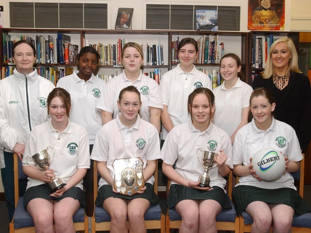 Mrs. Isobel McNulty, Head of PE, and Mrs. Kathgleen Gormley, principal, with members of the St. Cecilia's College All-Ireland winning netball team. Seated, from left, are Laura Grant, Lisa Coyle, Colleen Bonner and Leonie Bonner. Back, from left, are Kimberley Doherty, Julie Melaugh, Aoife O'Kane and Orla Cooper. (1912C10):.