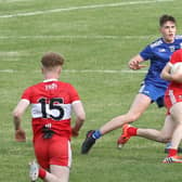 Matthew Downey takes on Monaghan's Ryan Duffy during 2020 Ulster Minor Football Championship Final.