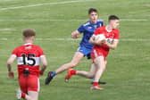 Matthew Downey takes on Monaghan's Ryan Duffy during 2020 Ulster Minor Football Championship Final.